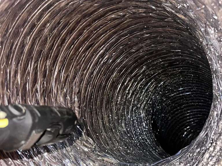 Inside the duct after the rotary brush: bare metal, clear to the end