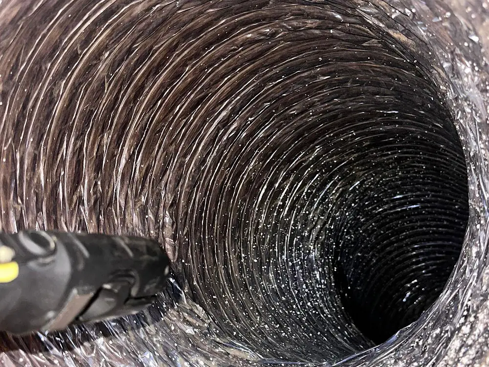 Inside the duct after the rotary brush: bare metal, clear to the end